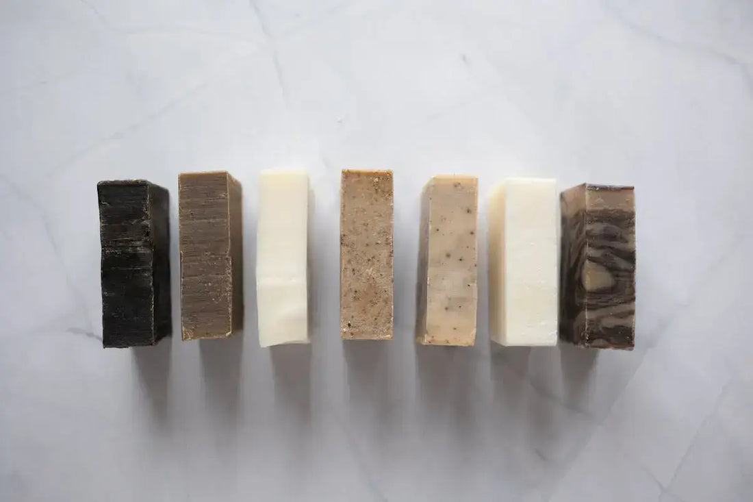A selection of seven premium bars of soap designed for men, featuring a range of masculine scents and natural ingredients for a refreshing and rejuvenating grooming experience.