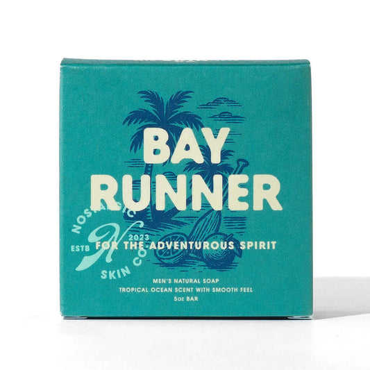 Bay Runner Soap packaging featuring bold typography and tropical design, emphasizing a fresh ocean scent for adventurous spirits.
