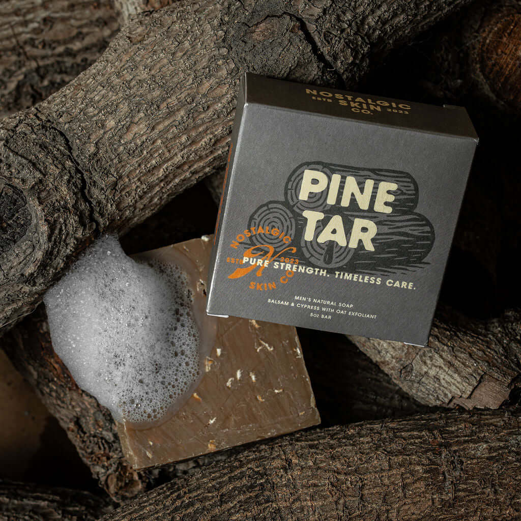 Bar of soap with a 'Pine Tar' packaging on a wooden background