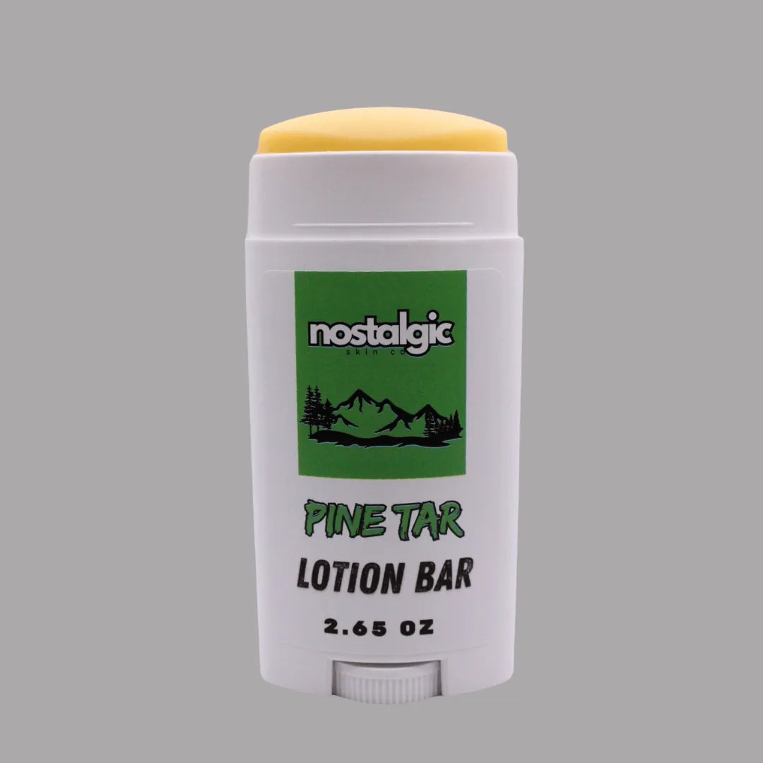 Pine Tar Lotion Bar stick in white packaging with yellow cap, featuring a green logo and mountains. 2.65 oz.