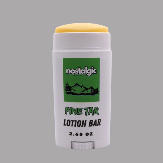 Pine Tar Lotion Bar stick in white packaging with yellow cap, featuring a green logo and mountains. 2.65 oz.